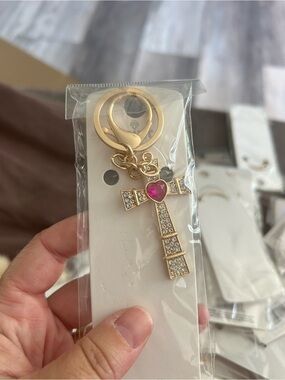 4/$50 Gold Rhinestone Cross Keychain with Pink Heart